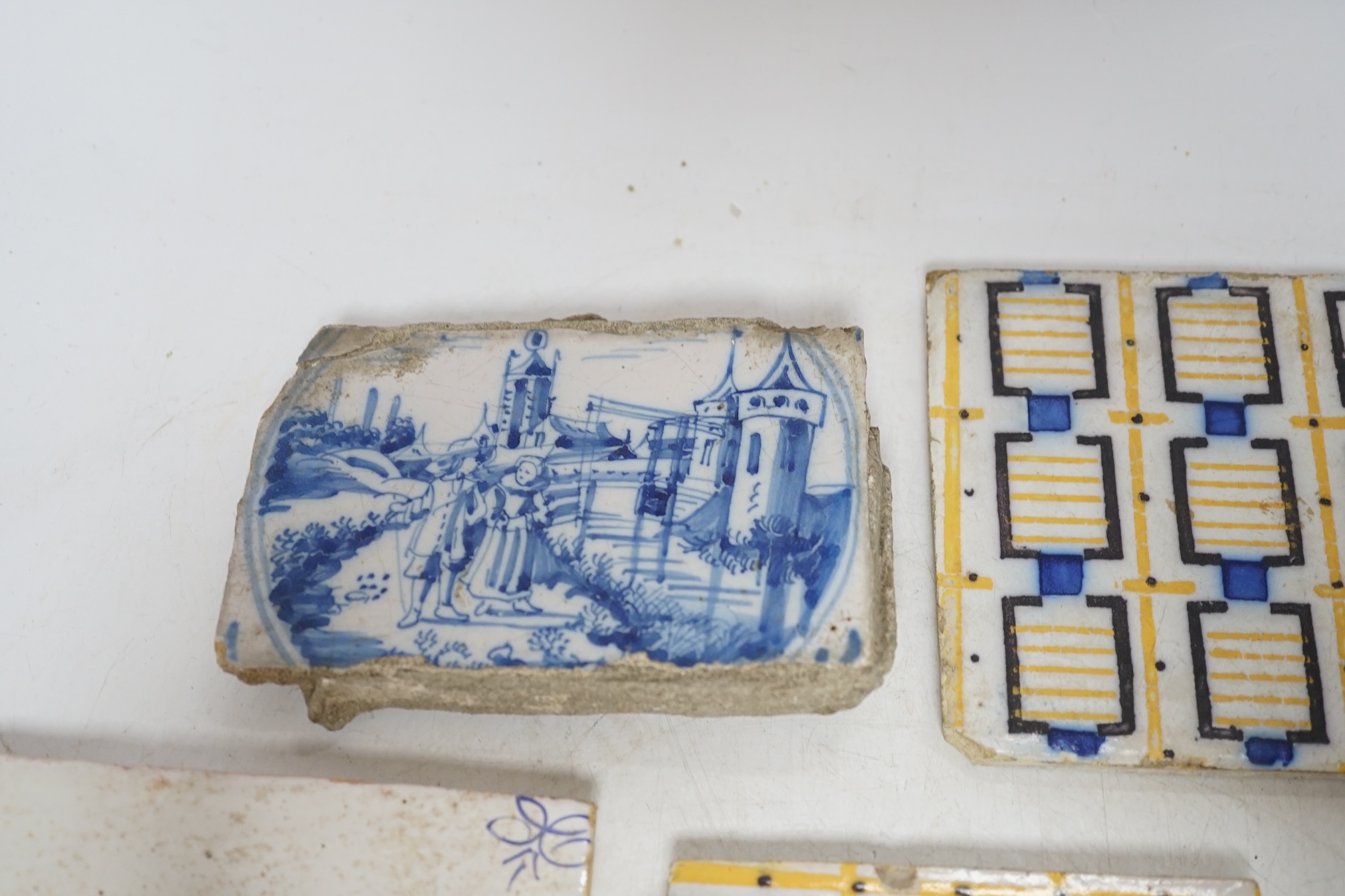 From the Studio of Fred Cuming. A group of tiles, mostly 19th / 20th century Delft, largest 23 x 23cm. Condition - fair